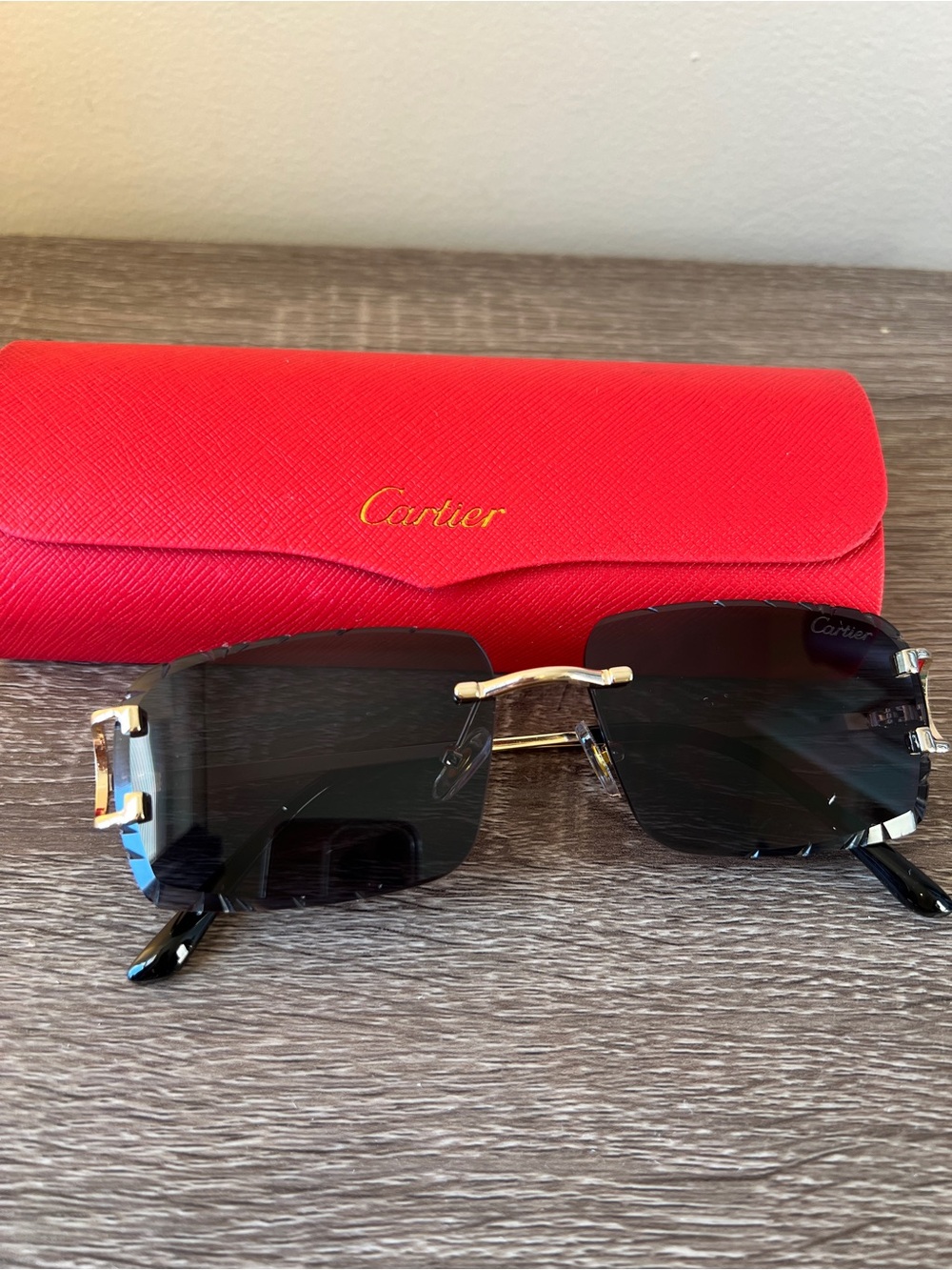 Cartier Men's Rimless Sunglasses in Black with Gold Accents